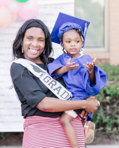 A Nurse-Family Partnership client and her child at program graduation